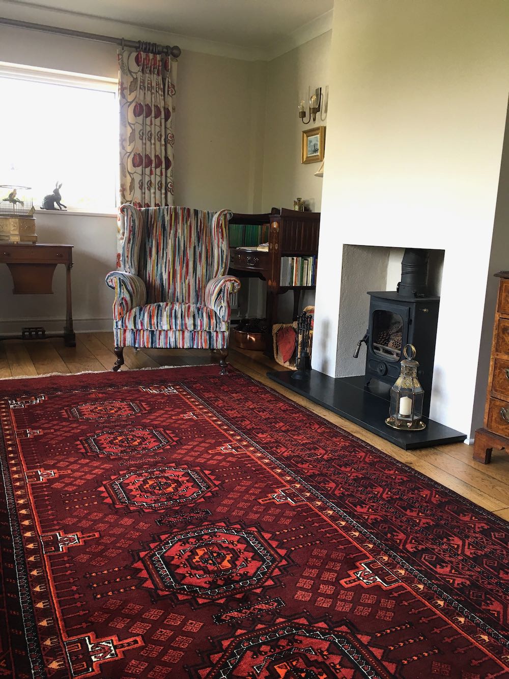 Stylist Interior With Persian Carpet, Old Pine Floor Boards u0026 Wood Burning  Stove